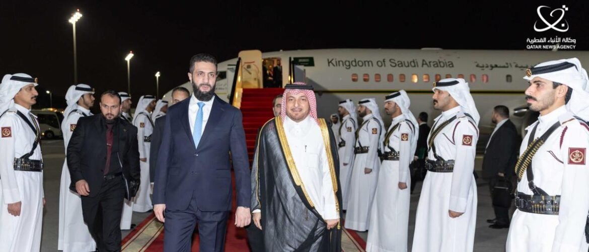 Dignitaries walk the red carpet at night beside uniformed guards as an aircraft labeled Kingdom of Saudi Arabia sits on the tarmac, Qatar News Agency logo in corner.
