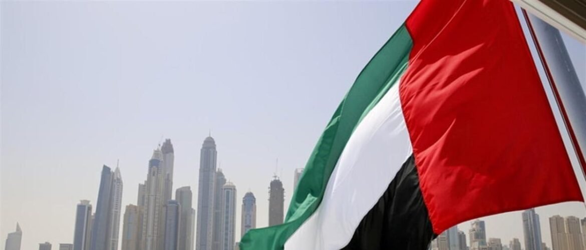 United Arab Emirates flag waving with Dubai's skyline in the background.