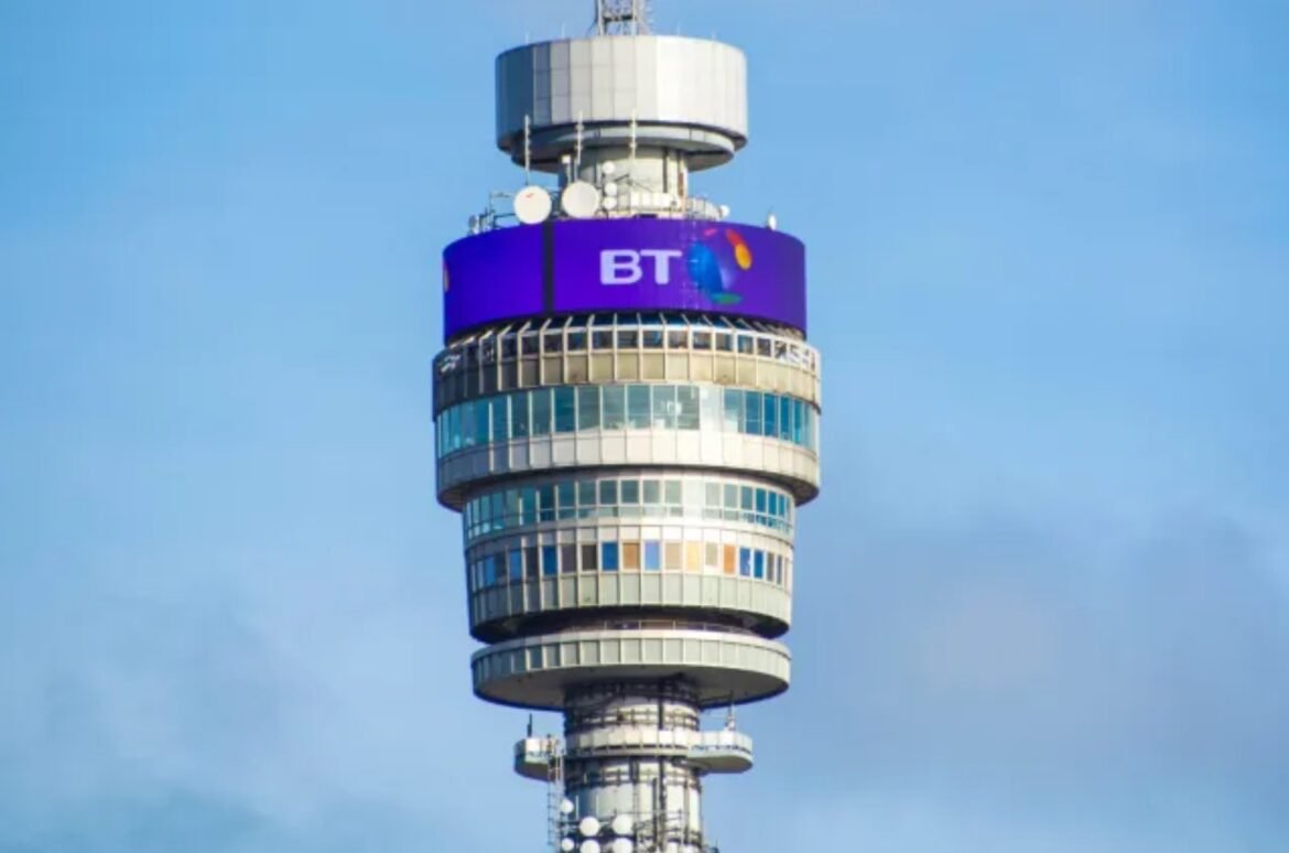 Telecommunications tower with a prominent BT sign and circular observation decks against a blue sky