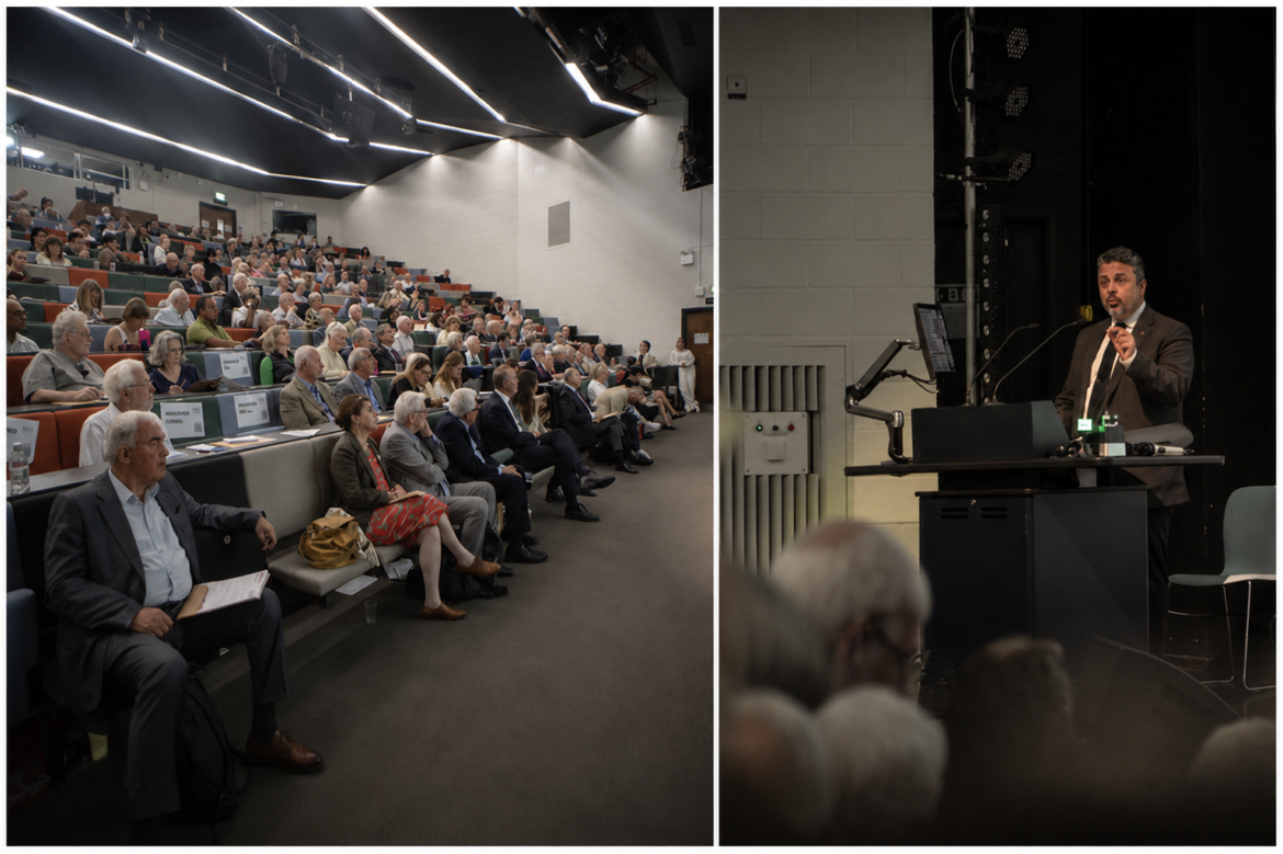 Split image: audience seated in a large lecture hall on the left, man speaking at a podium on the right.