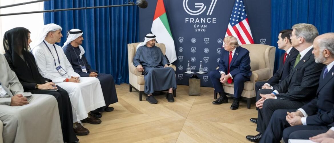 Leaders seated in a semi-circle discussing at a G7 Evian 2026 event, with a France backdrop and flags behind them in a formal room.