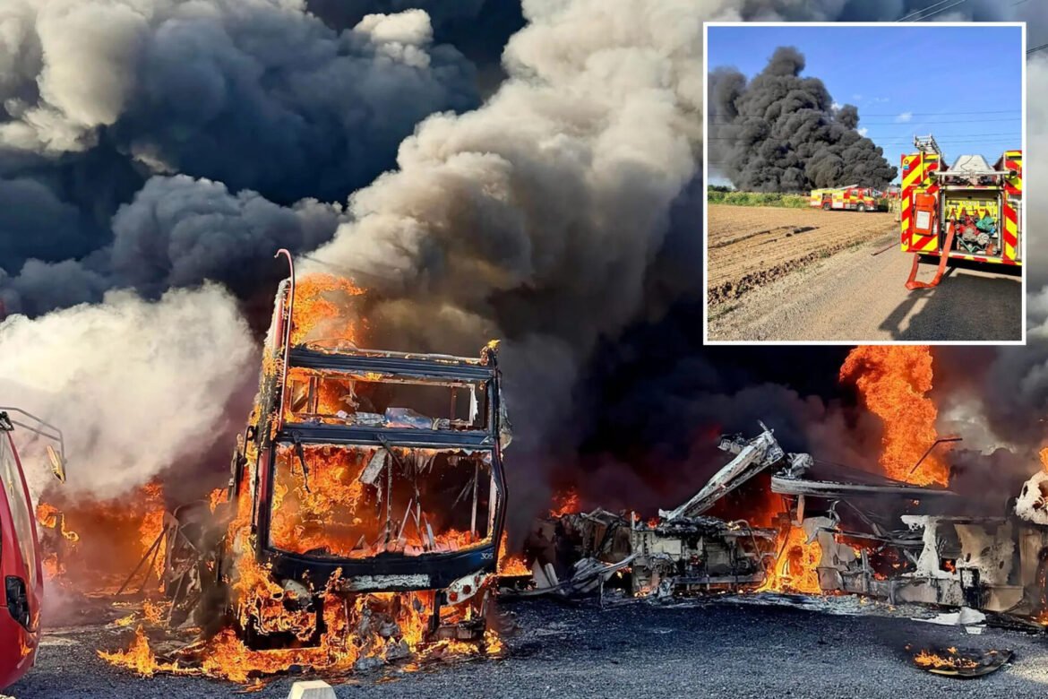 Bus burning with bright flames and dark smoke on a road; inset shows emergency vehicles at the scene.