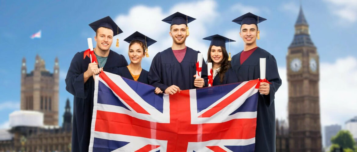 Group of five graduates in caps and gowns holding a Union Jack flag with Big Ben and a London skyline in the background.