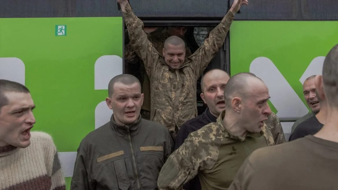 Soldiers in camouflage jackets step from a bright green bus, arms raised in celebration.
