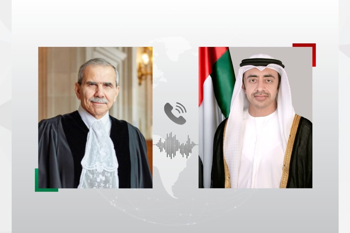 Two men in formal attire facing the camera, separated by a call icon and sound waves on a world-map background.
