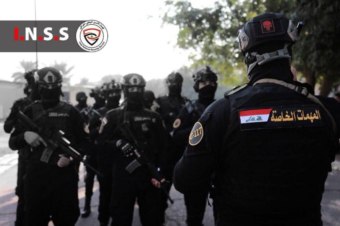 Group of heavily armed security forces in black tactical gear gathered on a street, INSS logo in the corner.