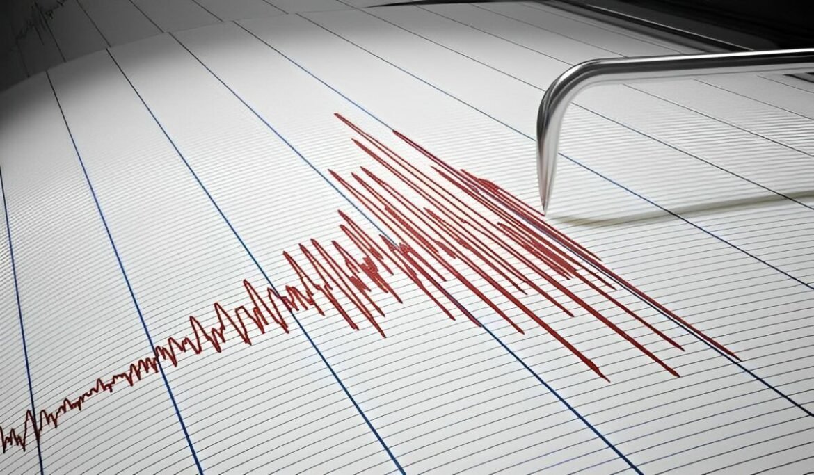 ECG readout on graph paper showing a jagged red heartbeat tracing with binder rings nearby.