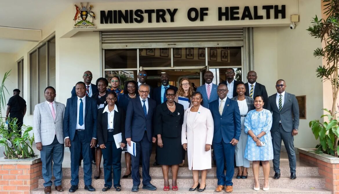 Group of diverse professionals in formal attire posing on the steps of the Ministry of Health building