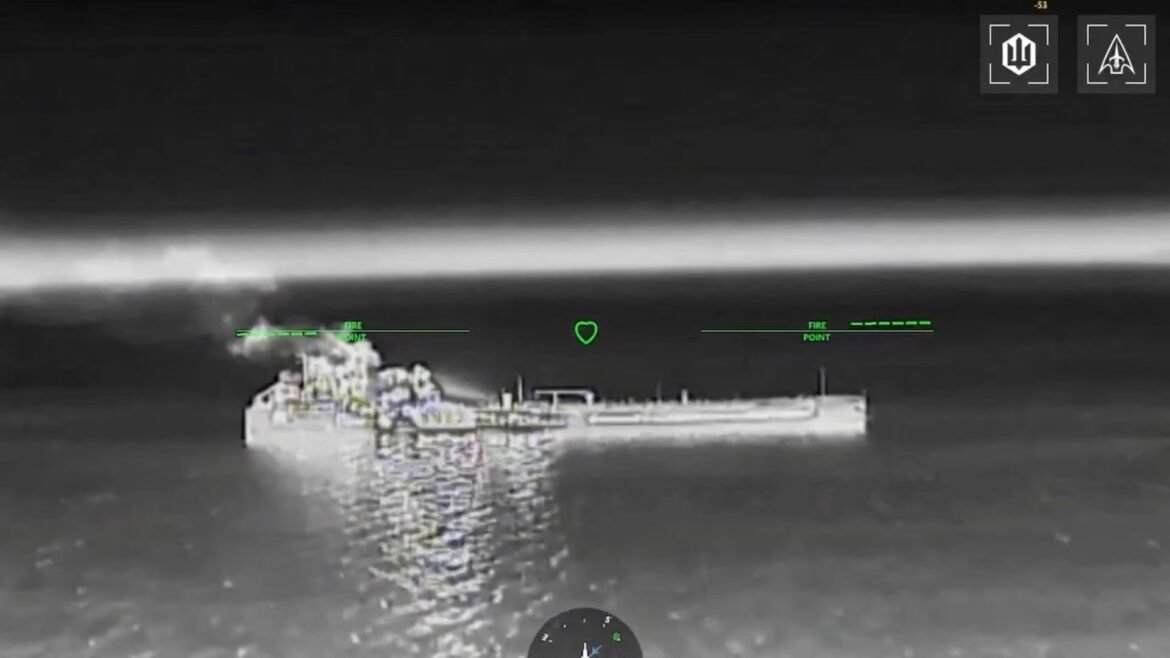 Night-vision ship cockpit with green HUD readouts over a burning vessel on dark water.