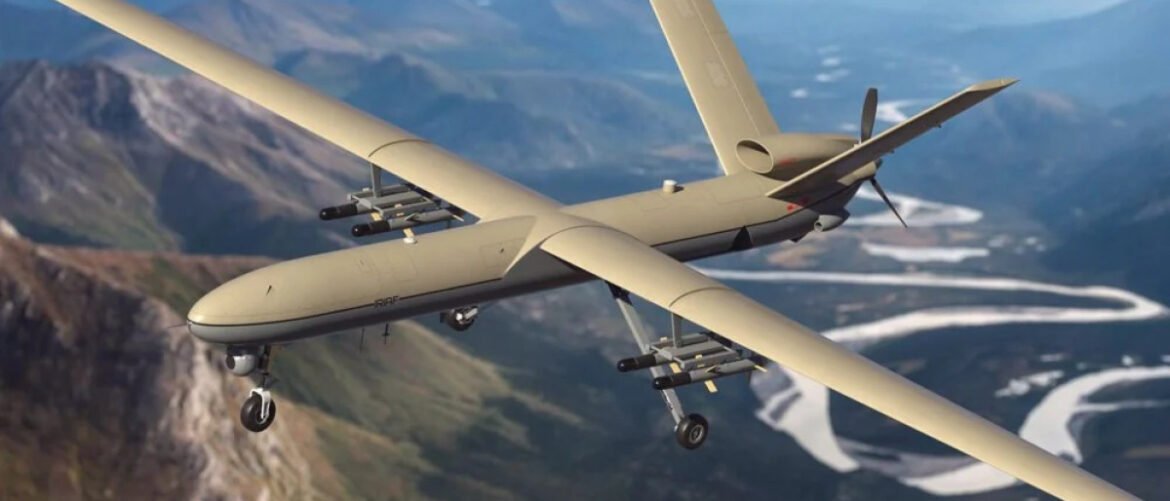 Fixed-wing UAV with underwing missiles cruising over a mountainous valley below a winding river.
