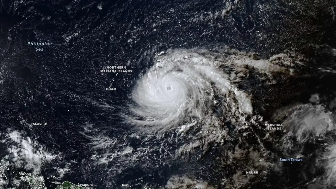 Satellite view of a large hurricane with a well-defined eye near the Northern Mariana Islands and Micronesia, with Palau visible to the southwest.