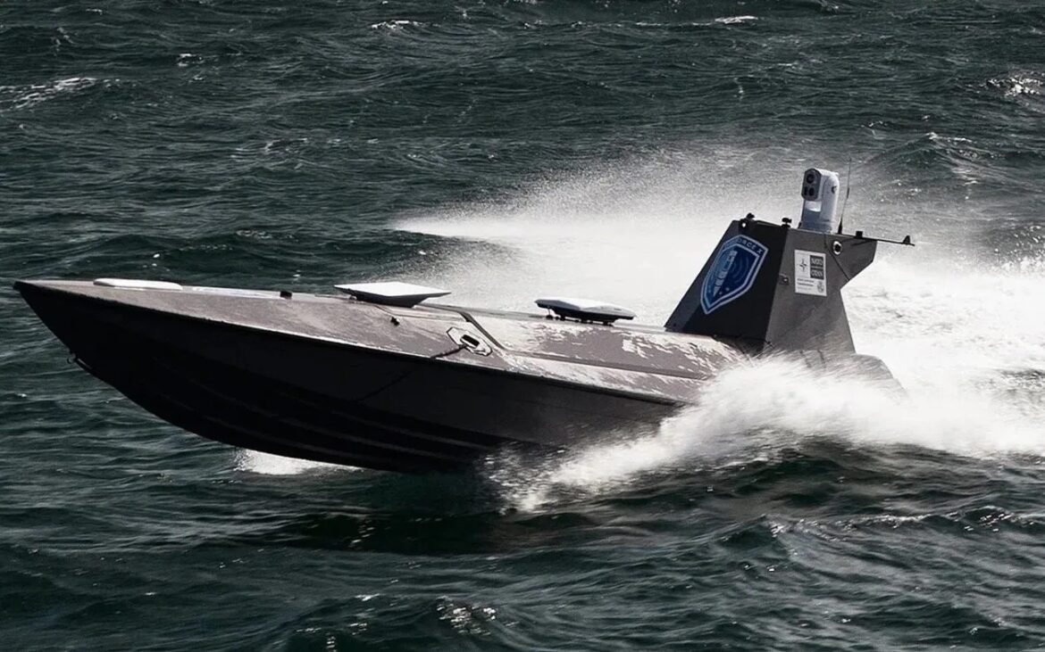 High-speed patrol boat skimming rough sea, spraying water as it speeds forward, with a blue emblem on the stern.