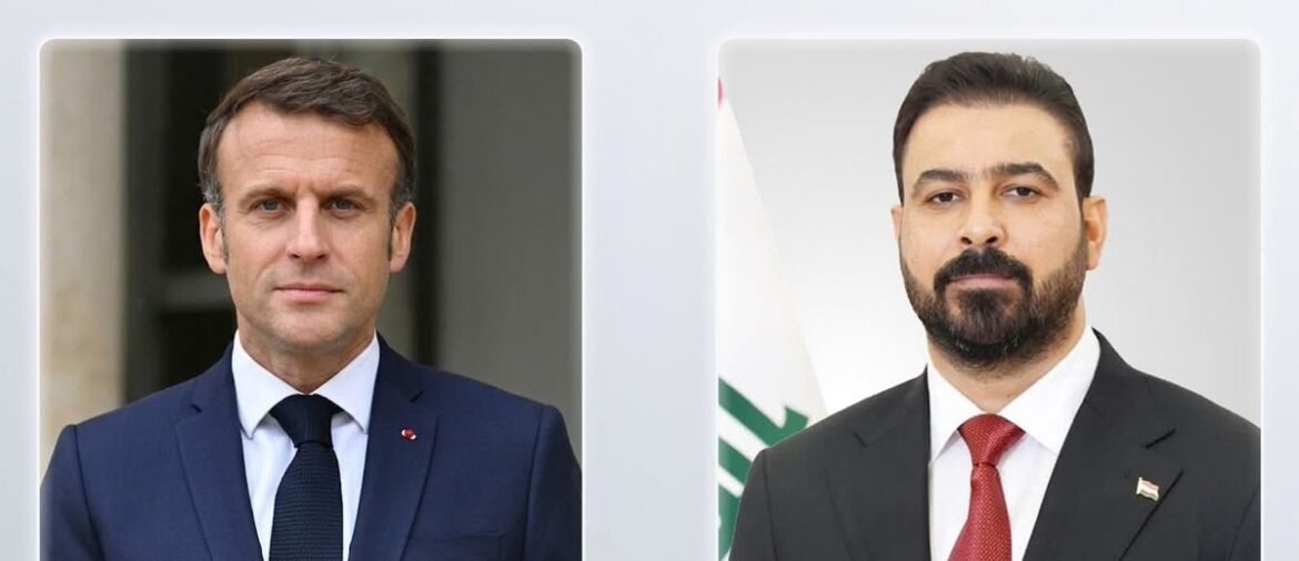 Two men in formal suits posing for a side-by-side portrait.