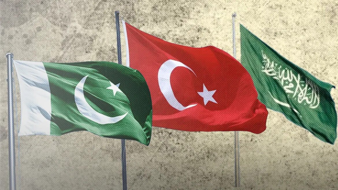 Three national flags flutter in the wind: Pakistan (green with crescent and star), Turkey (red with crescent and star), and Saudi Arabia (green with Arabic inscription).