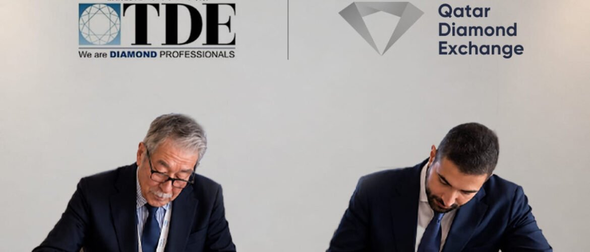 Two businessmen in dark suits sign documents at a signing ceremony, with TDE and Qatar Diamond Exchange logos visible above them.