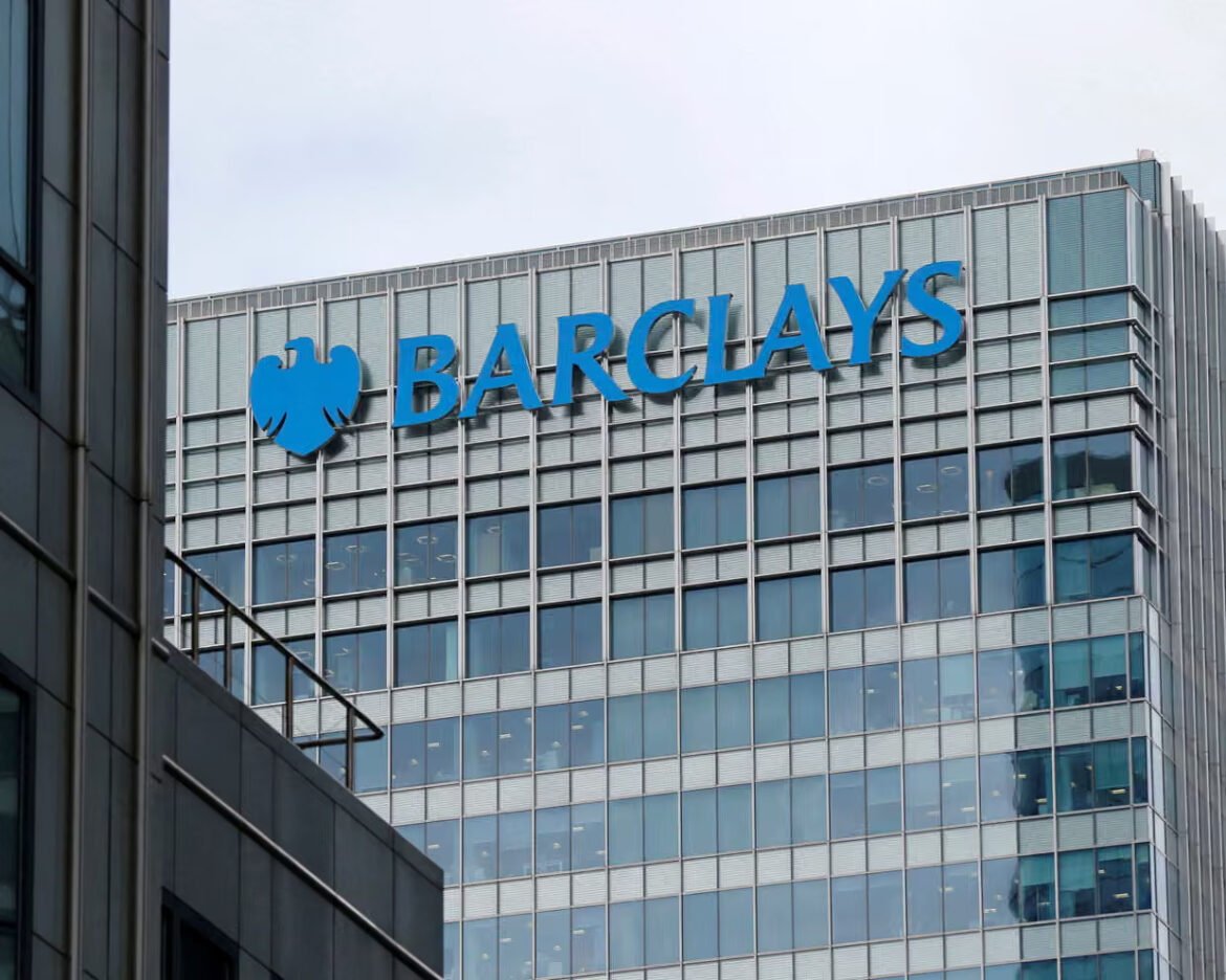 Barclays logo with blue eagle and the word BARCLAYS on a glass-clad office building façade.