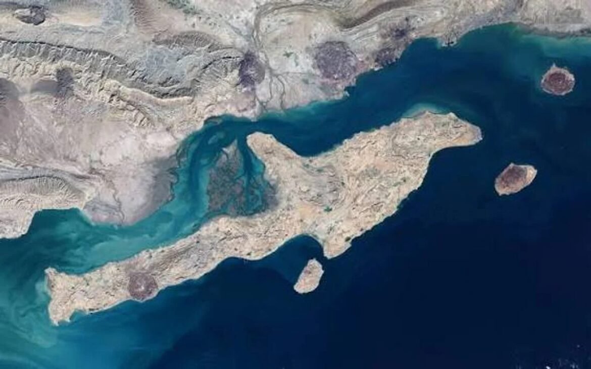 Aerial satellite view of a rocky coastal landmass with turquoise tidal channels and small surrounding islets.