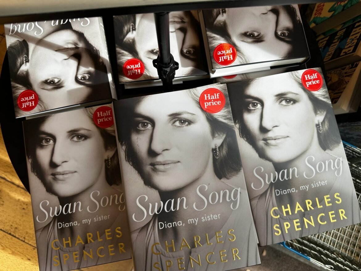 Book covers featuring a black-and-white portrait for 'Swan Song: Diana, my sister' by Charles Spencer, with a red 'Half price' sticker visible on several copies.